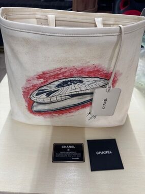 CHANEL Cream Canvas Tote with Red and Black Graphic